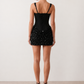 Women's Zehnia sequined basque waist mini dress featuring a structured corset bodice with boning, square neckline, wide adjustable straps, draped sequin mini skirt, lace-up back and flattering fitted silhouette, perfect for parties, cocktail evenings and special occasions.