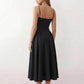 Women's sweetheart corset midi dress featuring a structured corset-inspired bodice, adjustable spaghetti straps, a defined waist, and a softly pleated A-line skirt. An elegant midi dress for weddings, cocktail parties, race days, and formal occasions.