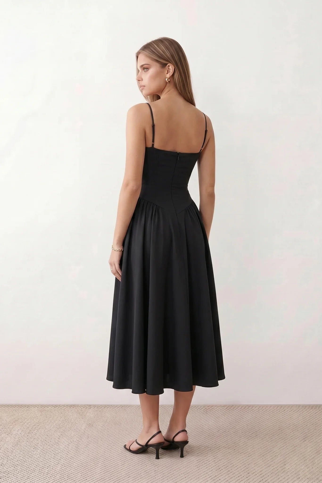 Women's sweetheart corset midi dress featuring a structured corset-inspired bodice, adjustable spaghetti straps, a defined waist, and a softly pleated A-line skirt. An elegant midi dress for weddings, cocktail parties, race days, and formal occasions.