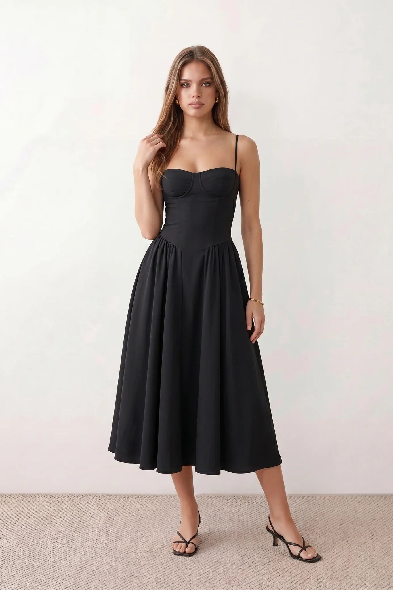 Women's sweetheart corset midi dress featuring a structured corset-inspired bodice, adjustable spaghetti straps, a defined waist, and a softly pleated A-line skirt. An elegant midi dress for weddings, cocktail parties, race days, and formal occasions.