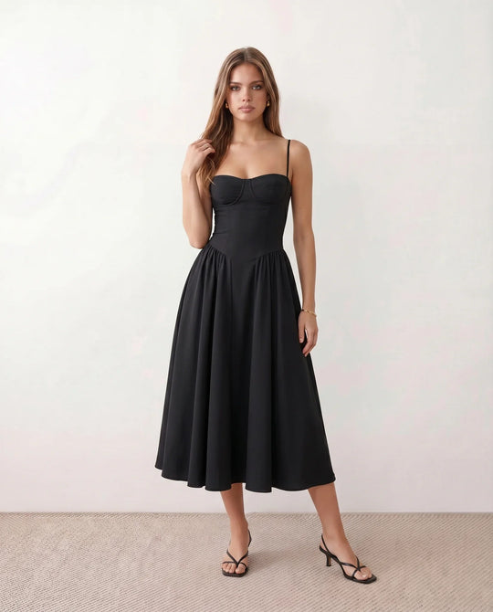Women's sweetheart corset midi dress featuring a structured corset-inspired bodice, adjustable spaghetti straps, a defined waist, and a softly pleated A-line skirt. An elegant midi dress for weddings, cocktail parties, race days, and formal occasions.