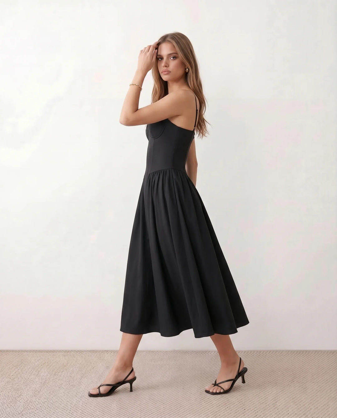 Women's sweetheart corset midi dress featuring a structured corset-inspired bodice, adjustable spaghetti straps, a defined waist, and a softly pleated A-line skirt. An elegant midi dress for weddings, cocktail parties, race days, and formal occasions.