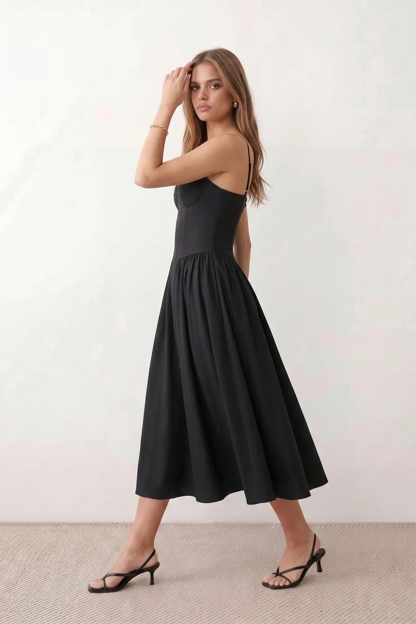 Women's sweetheart corset midi dress featuring a structured corset-inspired bodice, adjustable spaghetti straps, a defined waist, and a softly pleated A-line skirt. An elegant midi dress for weddings, cocktail parties, race days, and formal occasions.