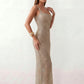 Woman wearing the Mihaela sequined low back maxi dress featuring allover sequin mesh, a square neckline, wide shoulder straps, a low open back, and a fitted floor-length sheath silhouette.
