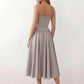Women's sweetheart corset midi dress featuring a structured corset-inspired bodice, adjustable spaghetti straps, a defined waist, and a softly pleated A-line skirt. An elegant midi dress for weddings, cocktail parties, race days, and formal occasions.