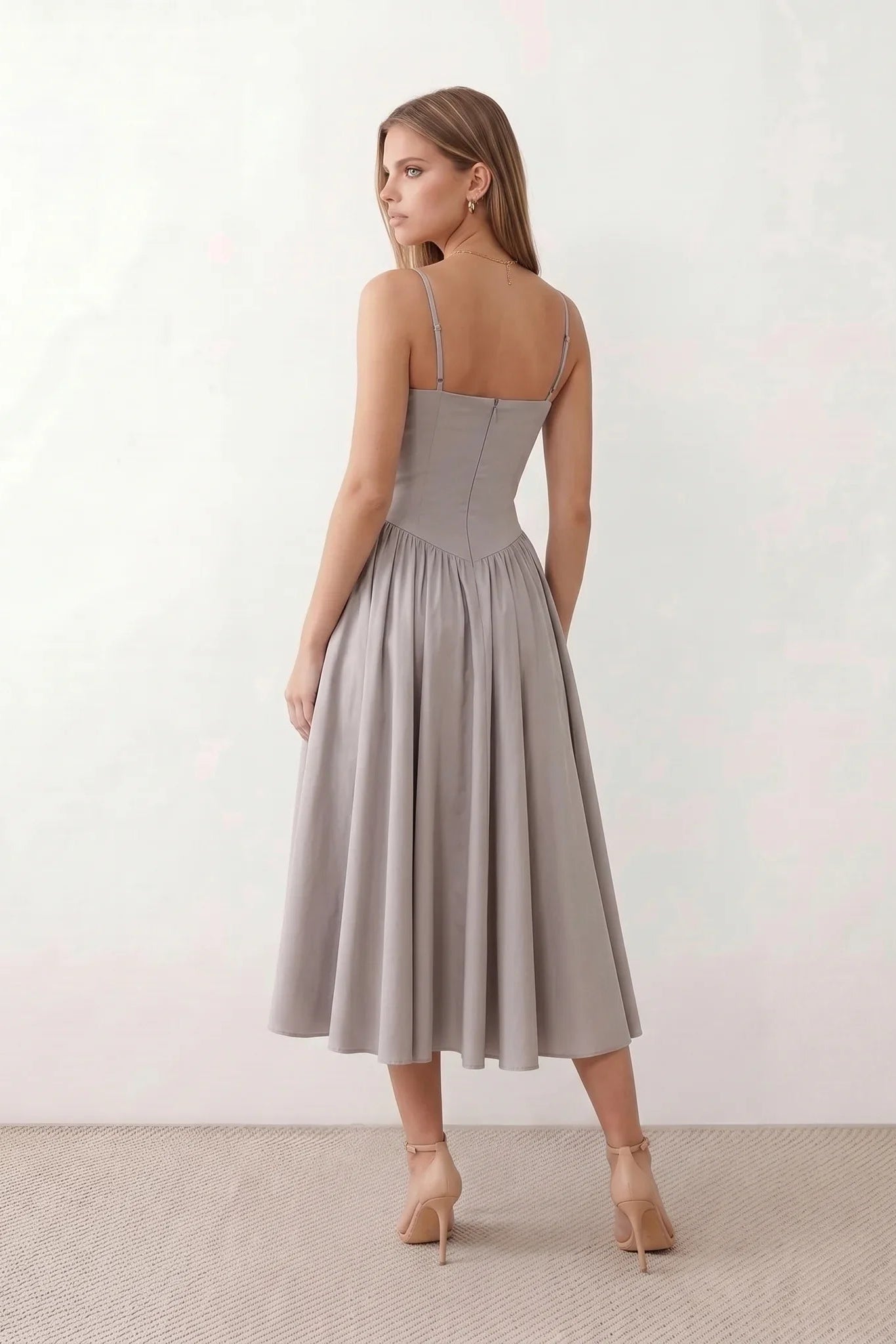 Women's sweetheart corset midi dress featuring a structured corset-inspired bodice, adjustable spaghetti straps, a defined waist, and a softly pleated A-line skirt. An elegant midi dress for weddings, cocktail parties, race days, and formal occasions.