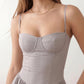 Women's sweetheart corset midi dress featuring a structured corset-inspired bodice, adjustable spaghetti straps, a defined waist, and a softly pleated A-line skirt. An elegant midi dress for weddings, cocktail parties, race days, and formal occasions.