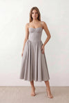Women's sweetheart corset midi dress featuring a structured corset-inspired bodice, adjustable spaghetti straps, a defined waist, and a softly pleated A-line skirt. An elegant midi dress for weddings, cocktail parties, race days, and formal occasions.