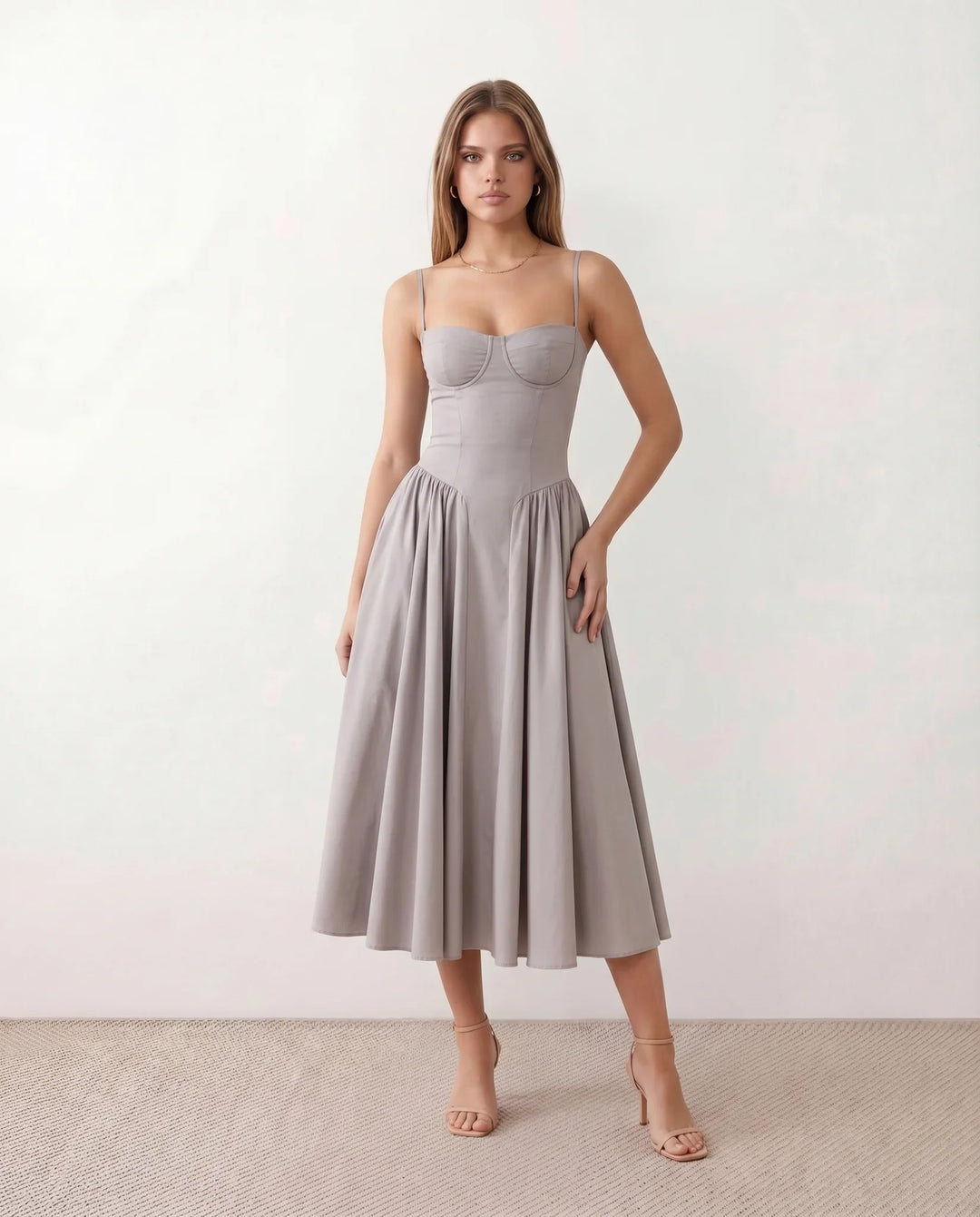 Women's sweetheart corset midi dress featuring a structured corset-inspired bodice, adjustable spaghetti straps, a defined waist, and a softly pleated A-line skirt. An elegant midi dress for weddings, cocktail parties, race days, and formal occasions.