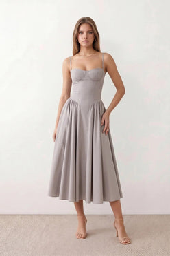 Women's sweetheart corset midi dress featuring a structured corset-inspired bodice, adjustable spaghetti straps, a defined waist, and a softly pleated A-line skirt. An elegant midi dress for weddings, cocktail parties, race days, and formal occasions.