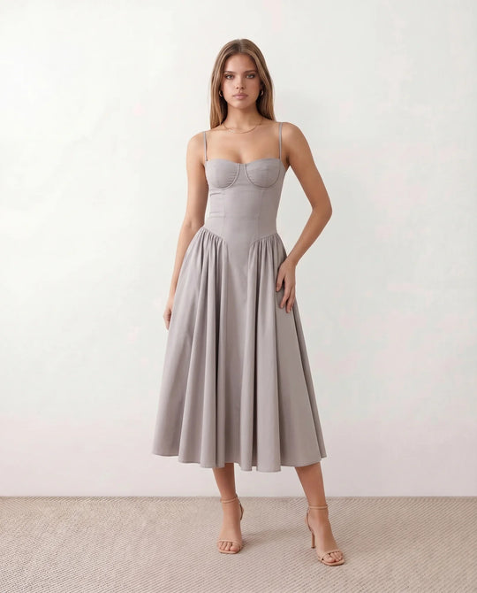 Women's sweetheart corset midi dress featuring a structured corset-inspired bodice, adjustable spaghetti straps, a defined waist, and a softly pleated A-line skirt. An elegant midi dress for weddings, cocktail parties, race days, and formal occasions.
