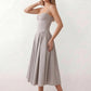 Women's sweetheart corset midi dress featuring a structured corset-inspired bodice, adjustable spaghetti straps, a defined waist, and a softly pleated A-line skirt. An elegant midi dress for weddings, cocktail parties, race days, and formal occasions.
