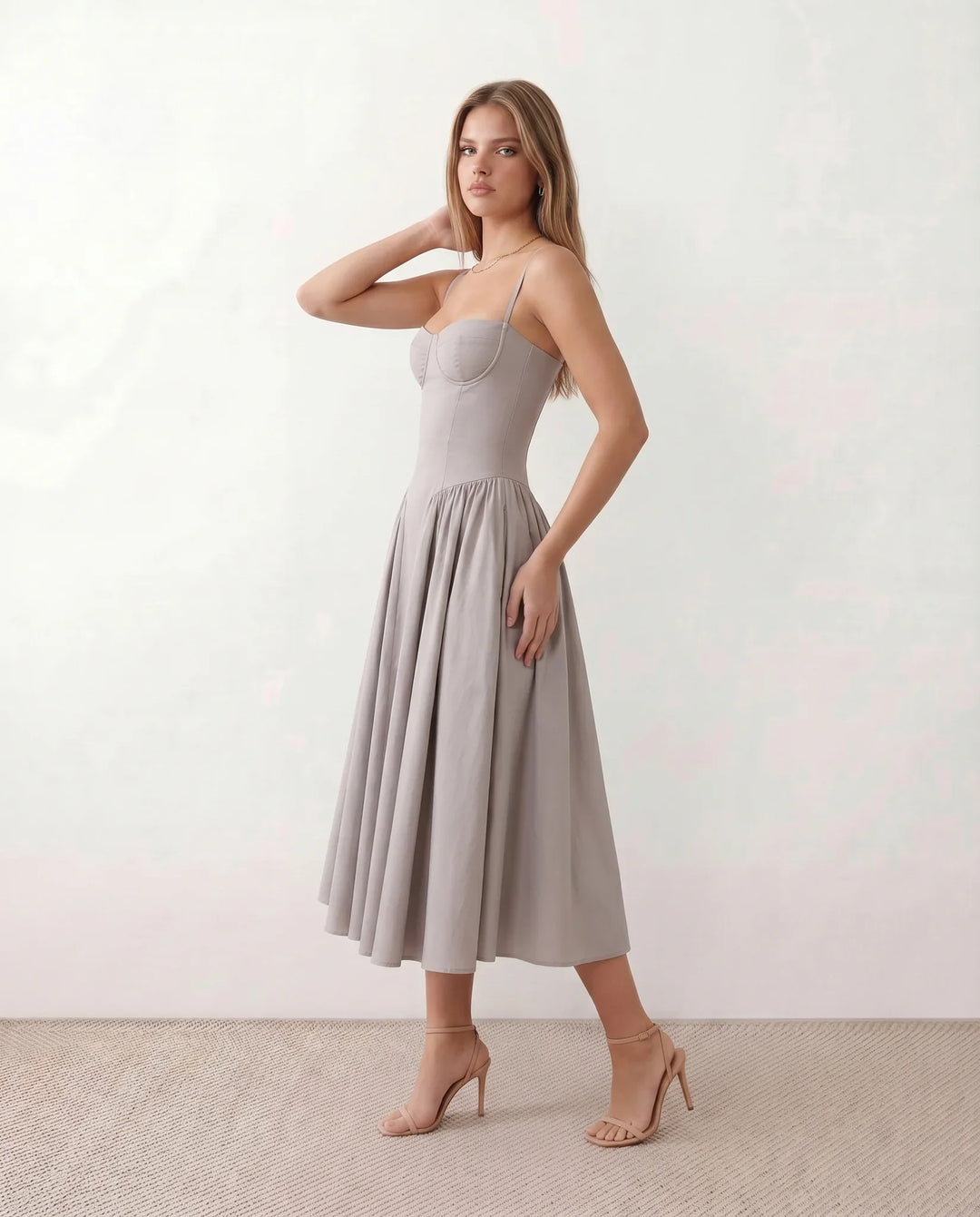 Women's sweetheart corset midi dress featuring a structured corset-inspired bodice, adjustable spaghetti straps, a defined waist, and a softly pleated A-line skirt. An elegant midi dress for weddings, cocktail parties, race days, and formal occasions.