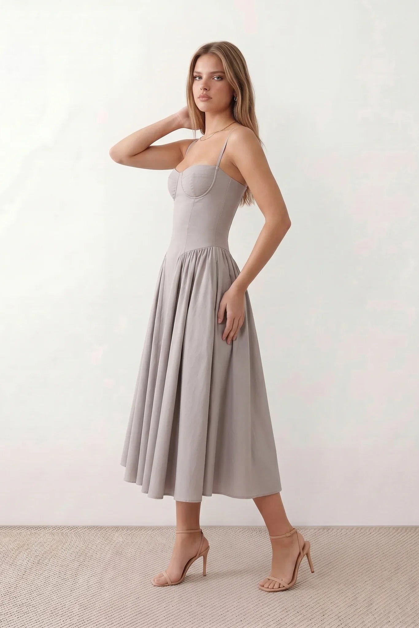 Women's sweetheart corset midi dress featuring a structured corset-inspired bodice, adjustable spaghetti straps, a defined waist, and a softly pleated A-line skirt. An elegant midi dress for weddings, cocktail parties, race days, and formal occasions.