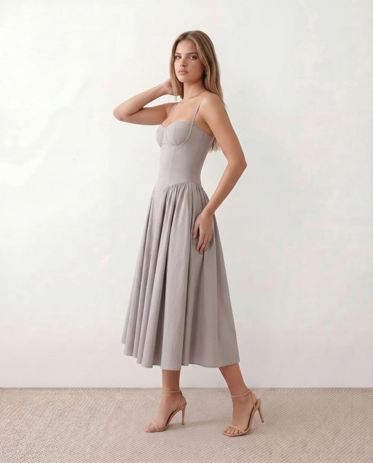 Women's sweetheart corset midi dress featuring a structured corset-inspired bodice, adjustable spaghetti straps, a defined waist, and a softly pleated A-line skirt. An elegant midi dress for weddings, cocktail parties, race days, and formal occasions.