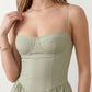 Women's sweetheart corset midi dress featuring a structured corset-inspired bodice, adjustable spaghetti straps, a defined waist, and a softly pleated A-line skirt. An elegant midi dress for weddings, cocktail parties, race days, and formal occasions.