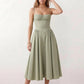 Women's sweetheart corset midi dress featuring a structured corset-inspired bodice, adjustable spaghetti straps, a defined waist, and a softly pleated A-line skirt. An elegant midi dress for weddings, cocktail parties, race days, and formal occasions.