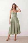 Women's sweetheart corset midi dress featuring a structured corset-inspired bodice, adjustable spaghetti straps, a defined waist, and a softly pleated A-line skirt. An elegant midi dress for weddings, cocktail parties, race days, and formal occasions.
