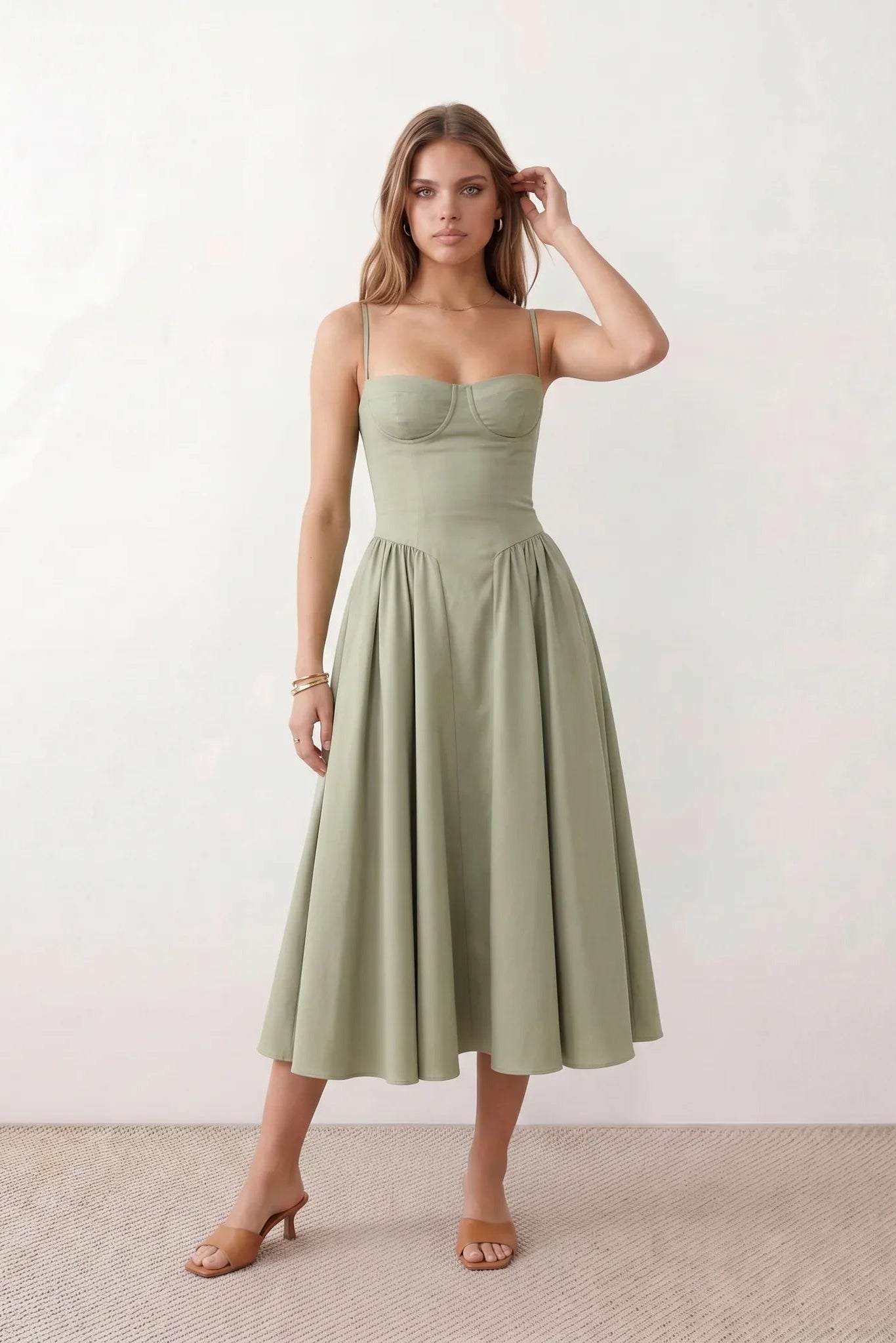 Women's sweetheart corset midi dress featuring a structured corset-inspired bodice, adjustable spaghetti straps, a defined waist, and a softly pleated A-line skirt. An elegant midi dress for weddings, cocktail parties, race days, and formal occasions.