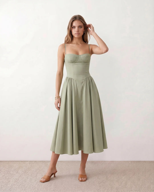 Women's sweetheart corset midi dress featuring a structured corset-inspired bodice, adjustable spaghetti straps, a defined waist, and a softly pleated A-line skirt. An elegant midi dress for weddings, cocktail parties, race days, and formal occasions.