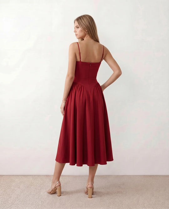 Women's sweetheart corset midi dress featuring a structured corset-inspired bodice, adjustable spaghetti straps, a defined waist, and a softly pleated A-line skirt. An elegant midi dress for weddings, cocktail parties, race days, and formal occasions.