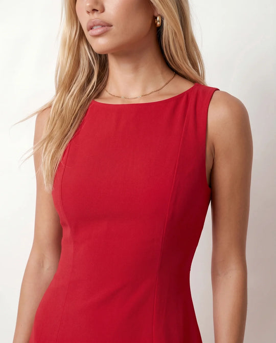 Maraea fitted sleeveless mini dress with a boat neckline, structured sheath silhouette, smooth finish, straight mini hem, and center back zip closure.