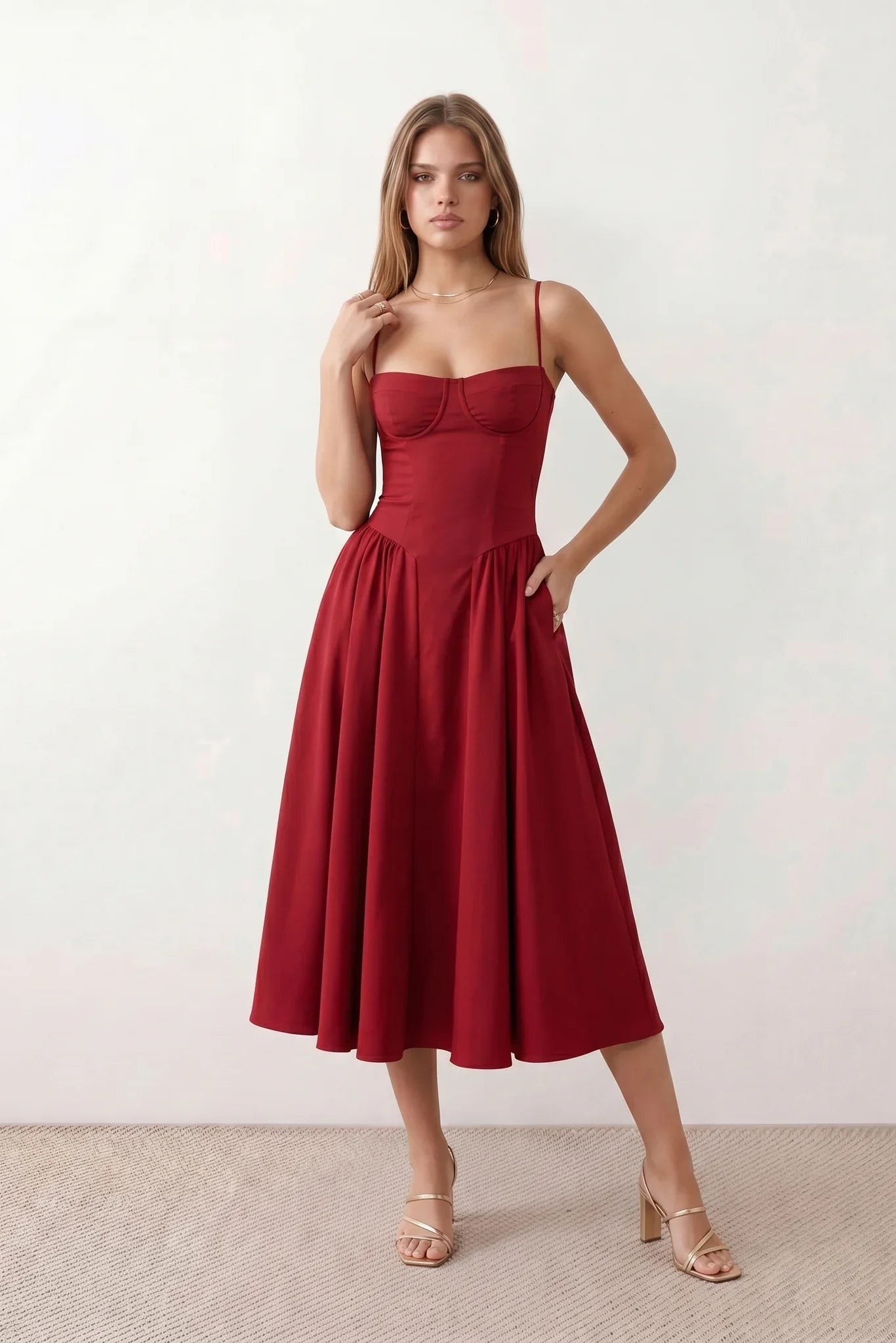 Women's sweetheart corset midi dress featuring a structured corset-inspired bodice, adjustable spaghetti straps, a defined waist, and a softly pleated A-line skirt. An elegant midi dress for weddings, cocktail parties, race days, and formal occasions.