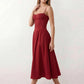 Women's sweetheart corset midi dress featuring a structured corset-inspired bodice, adjustable spaghetti straps, a defined waist, and a softly pleated A-line skirt. An elegant midi dress for weddings, cocktail parties, race days, and formal occasions.