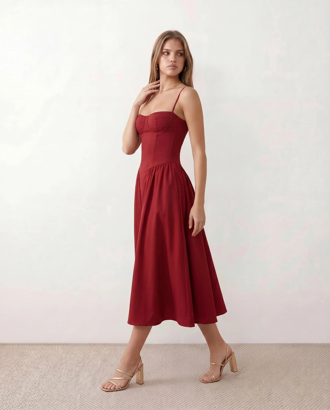 Women's sweetheart corset midi dress featuring a structured corset-inspired bodice, adjustable spaghetti straps, a defined waist, and a softly pleated A-line skirt. An elegant midi dress for weddings, cocktail parties, race days, and formal occasions.