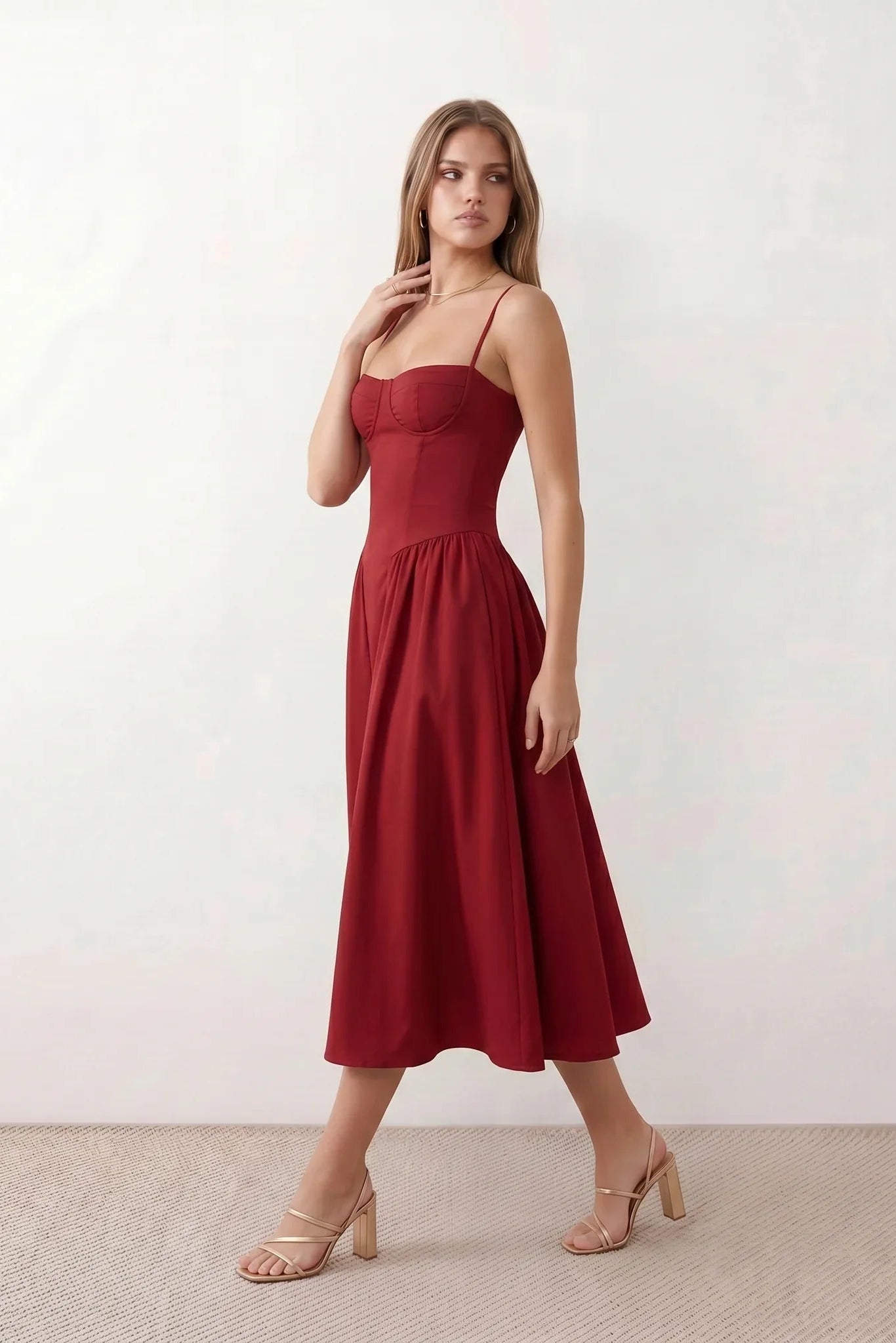 Women's sweetheart corset midi dress featuring a structured corset-inspired bodice, adjustable spaghetti straps, a defined waist, and a softly pleated A-line skirt. An elegant midi dress for weddings, cocktail parties, race days, and formal occasions.