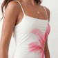 Women's floral slip maxi dress with a square neckline, delicate spaghetti straps, and a body-skimming silhouette featuring an all-over floral print on a sheer mesh overlay, ideal for weddings, summer occasions, and elegant evening wear.