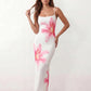 Women's floral slip maxi dress with a square neckline, delicate spaghetti straps, and a body-skimming silhouette featuring an all-over floral print on a sheer mesh overlay, ideal for weddings, summer occasions, and elegant evening wear.