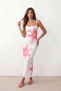 Women's floral slip maxi dress with a square neckline, delicate spaghetti straps, and a body-skimming silhouette featuring an all-over floral print on a sheer mesh overlay, ideal for weddings, summer occasions, and elegant evening wear.