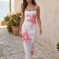 Women's floral slip maxi dress with a square neckline, delicate spaghetti straps, and a body-skimming silhouette featuring an all-over floral print on a sheer mesh overlay, ideal for weddings, summer occasions, and elegant evening wear.