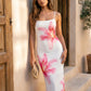 Women's floral slip maxi dress with a square neckline, delicate spaghetti straps, and a body-skimming silhouette featuring an all-over floral print on a sheer mesh overlay, ideal for weddings, summer occasions, and elegant evening wear.