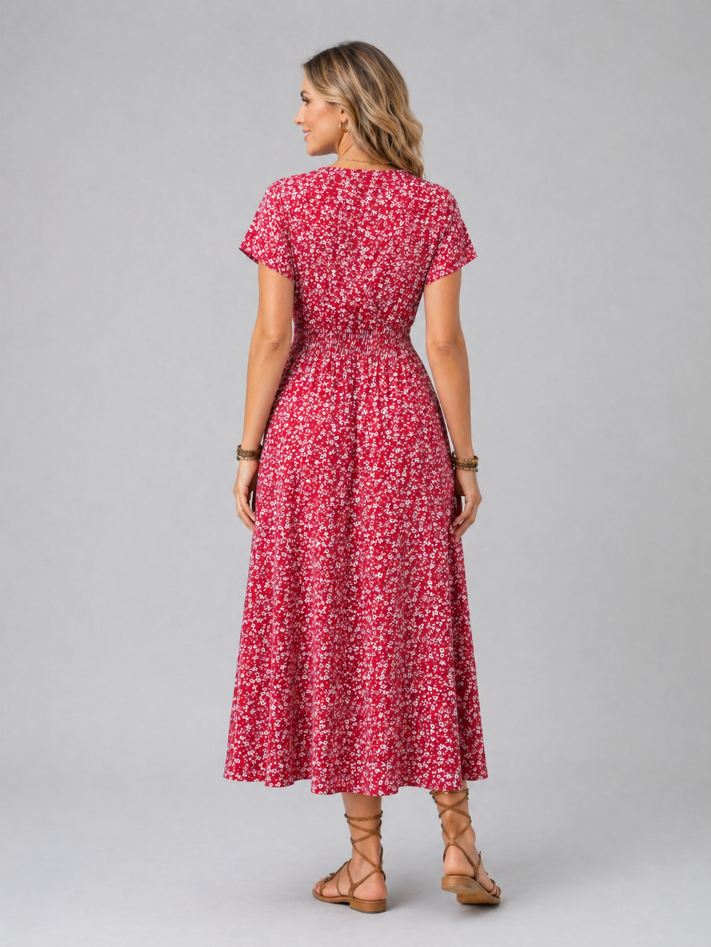 Women’s floral midi dress with butterfly sleeves, slit detail, and flowing silhouette