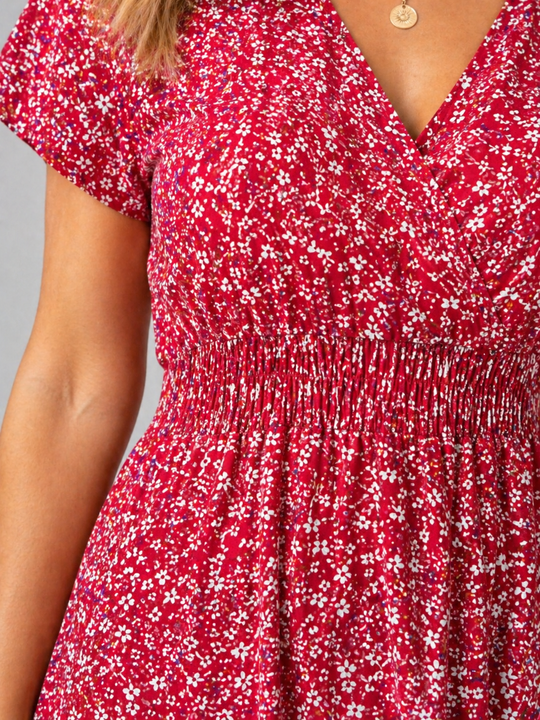 Women’s floral midi dress with butterfly sleeves, slit detail, and flowing silhouette