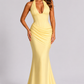 Women’s halter corset maxi gown featuring a plunging neckline, structured bodice, asymmetric pleated draping, and a flowing full-length skirt for formal occasions.