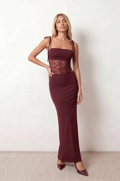 Women’s lace panel maxi dress featuring a square neckline, adjustable spaghetti straps, sheer lace waist, low open back, and floor-length silhouette for evening wear.