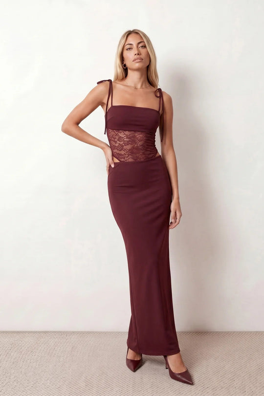 Women’s lace panel maxi dress featuring a square neckline, adjustable spaghetti straps, sheer lace waist, low open back, and floor-length silhouette for evening wear.