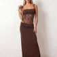 Women’s lace panel maxi dress featuring a square neckline, adjustable spaghetti straps, sheer lace waist, low open back, and floor-length silhouette for evening wear.