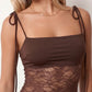 Women’s lace panel maxi dress featuring a square neckline, adjustable spaghetti straps, sheer lace waist, low open back, and floor-length silhouette for evening wear.