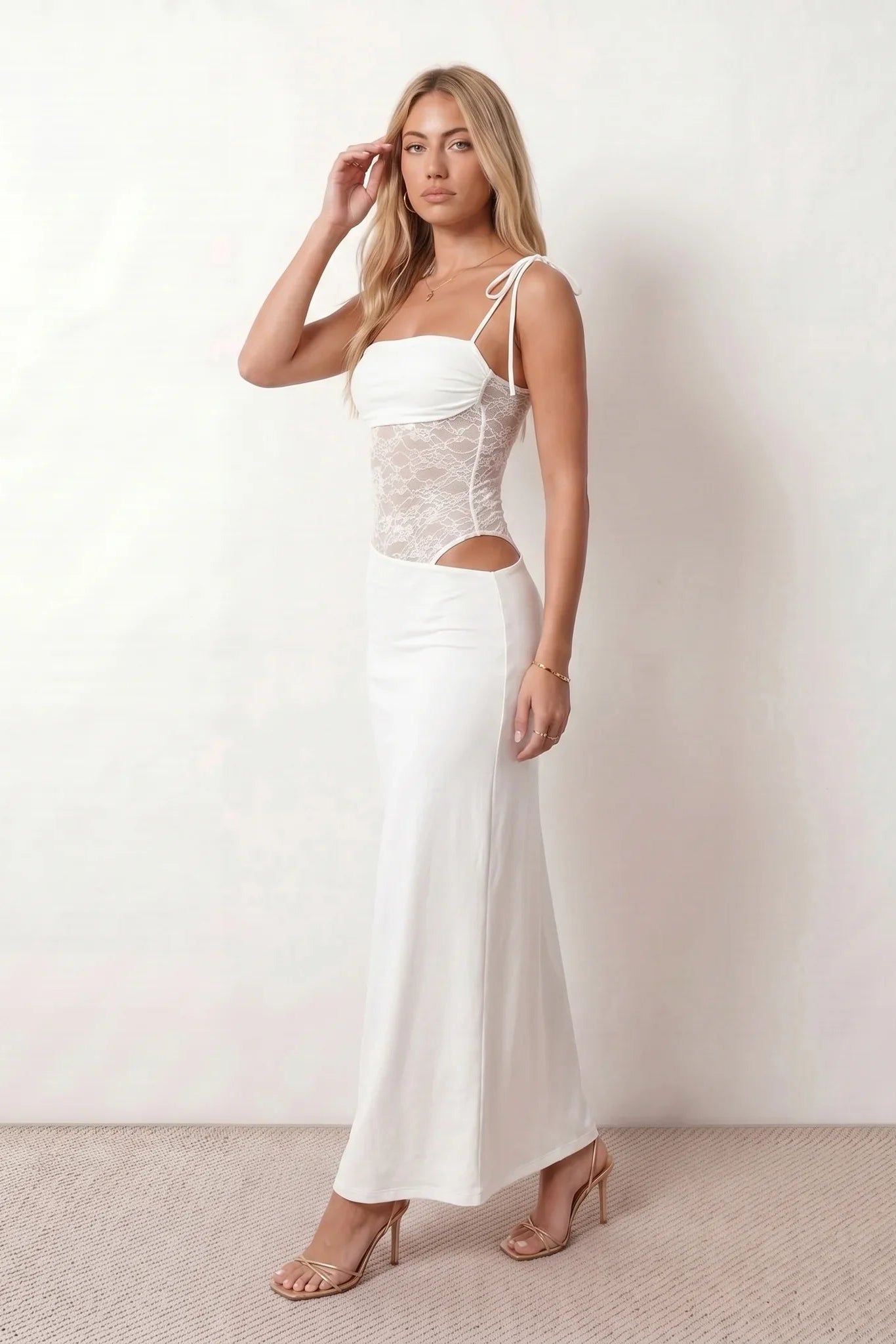 Women’s lace panel maxi dress featuring a square neckline, adjustable spaghetti straps, sheer lace waist, low open back, and floor-length silhouette for evening wear.