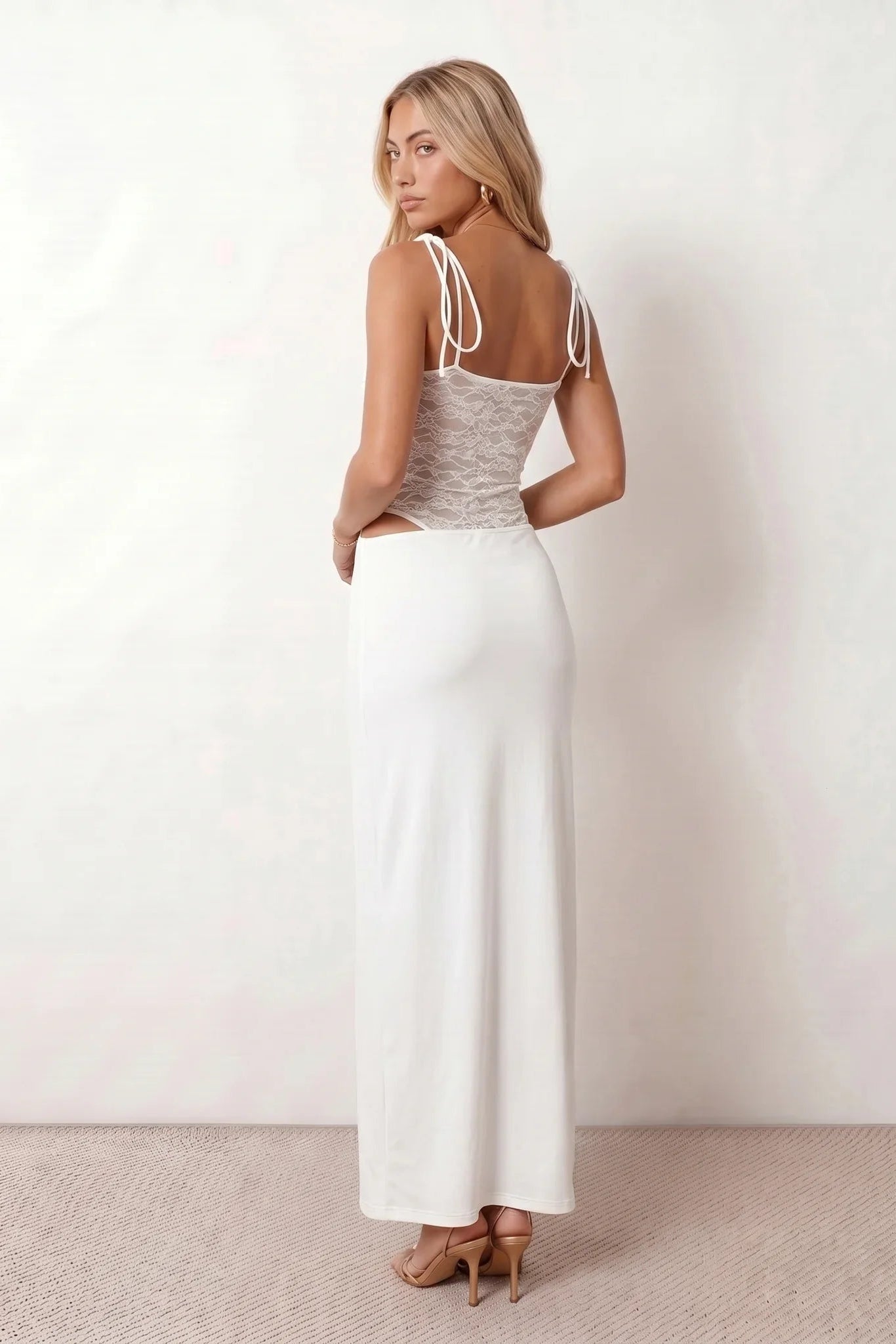 Women’s lace panel maxi dress featuring a square neckline, adjustable spaghetti straps, sheer lace waist, low open back, and floor-length silhouette for evening wear.