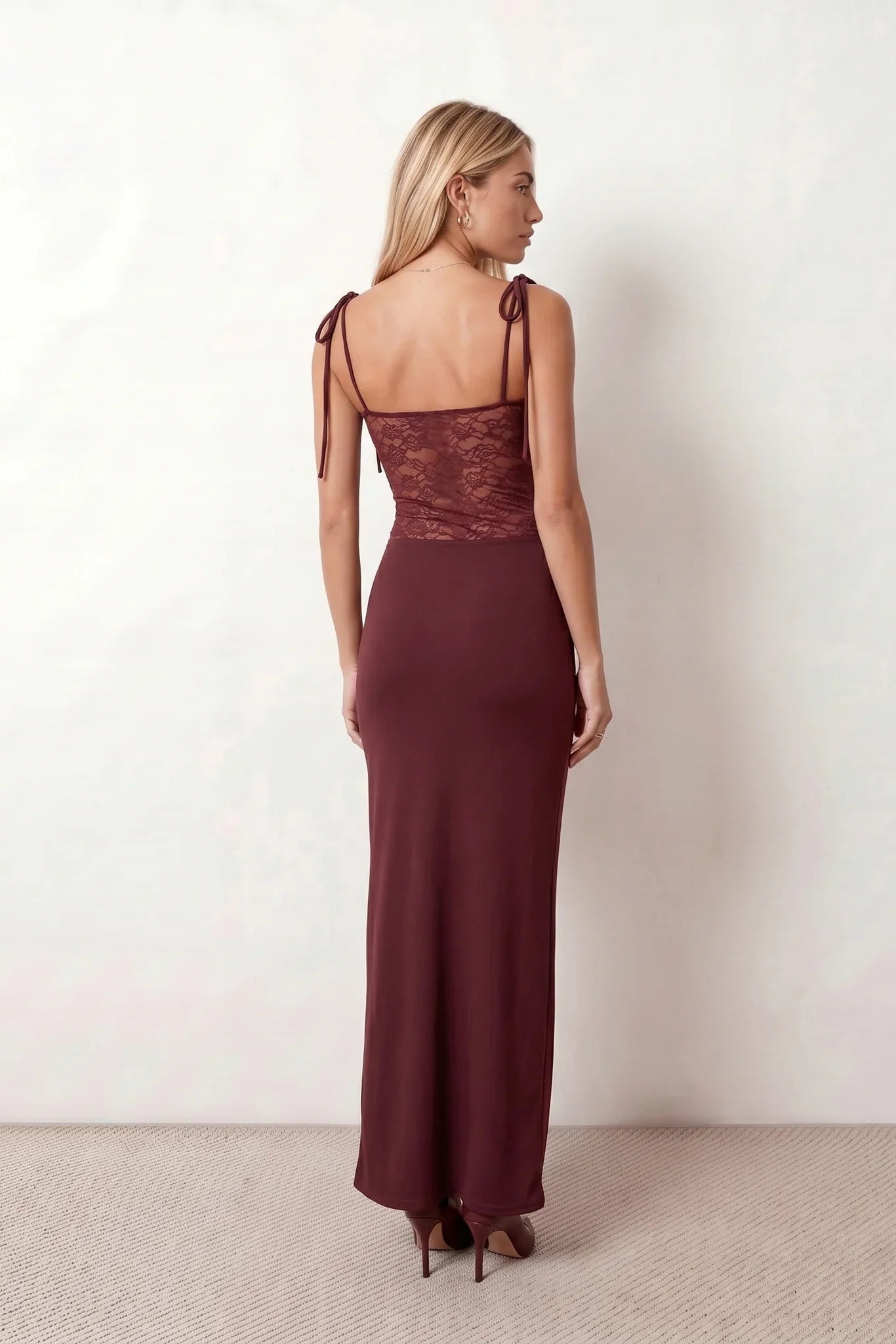 Women’s lace panel maxi dress featuring a square neckline, adjustable spaghetti straps, sheer lace waist, low open back, and floor-length silhouette for evening wear.