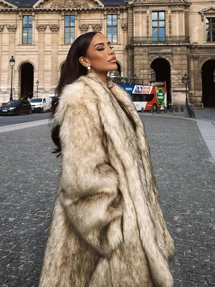 Women’s luxe faux fur coat featuring a plush textured finish and elegant silhouette for winter, evening, and special occasion styling.