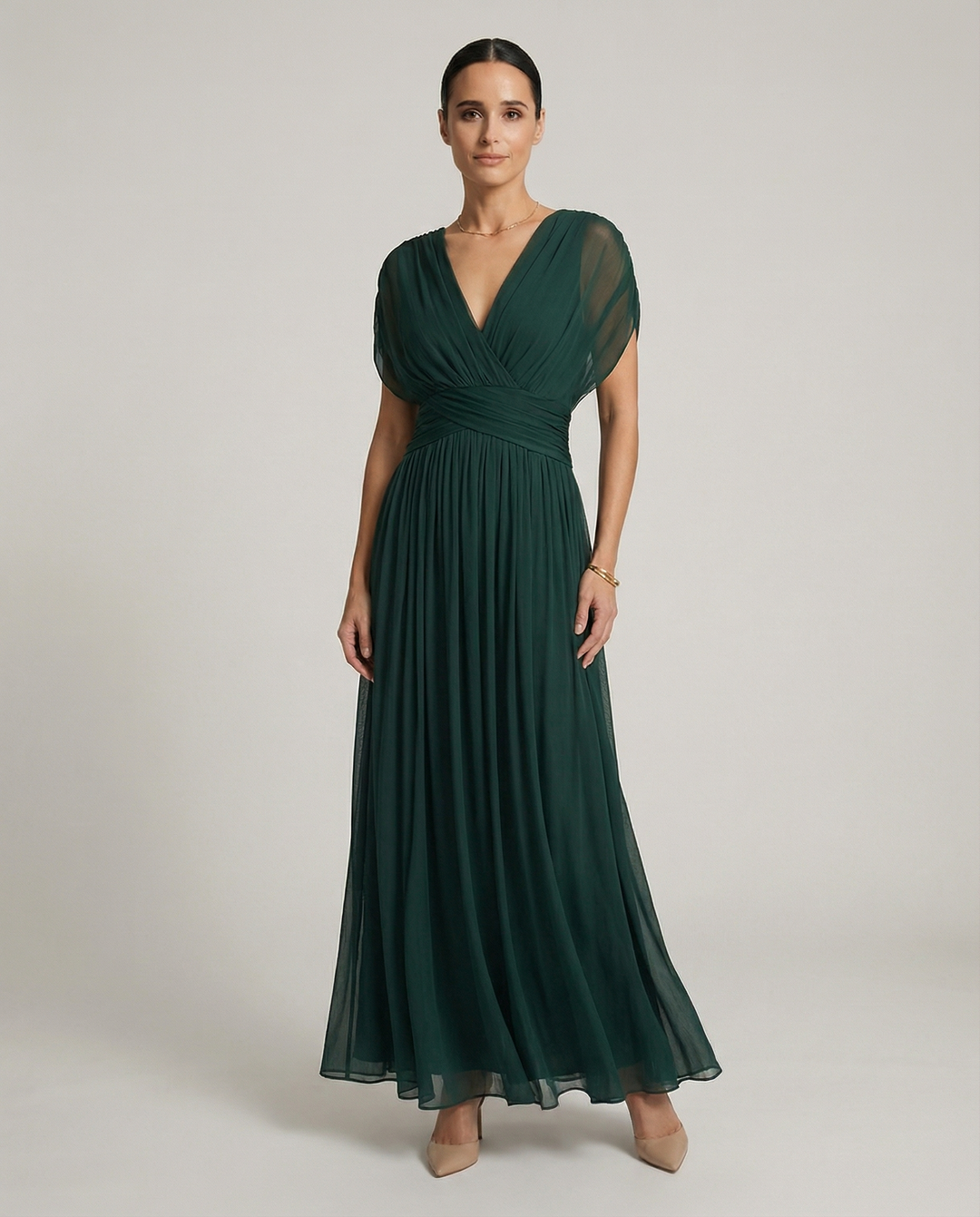 Women’s pleated V-neck maxi dress with flowing skirt and soft gradient tones