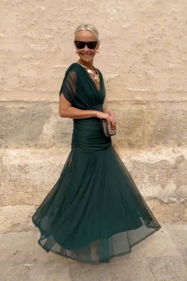 Women’s pleated V-neck maxi dress with flowing skirt and soft gradient tones