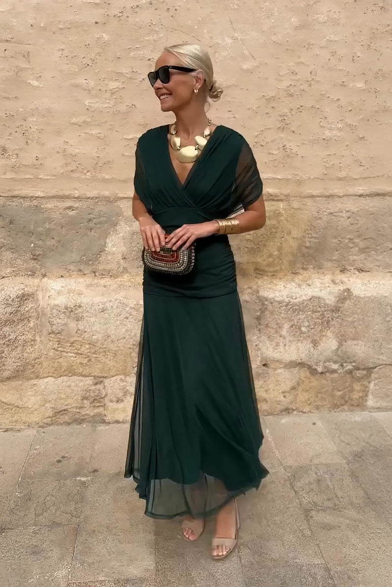 Women’s pleated V-neck maxi dress with flowing skirt and soft gradient tones