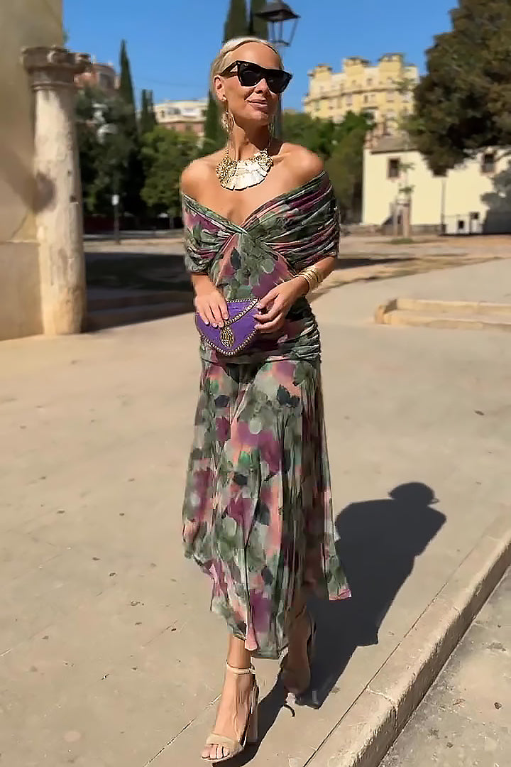 Women’s pleated V-neck maxi dress with flowing skirt and soft gradient tones